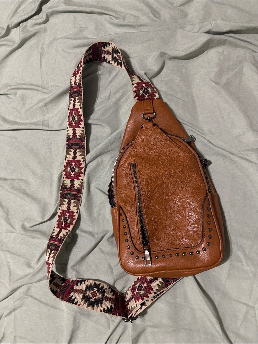 Tan Embossed Leather Sling Bag with Patterned Strap